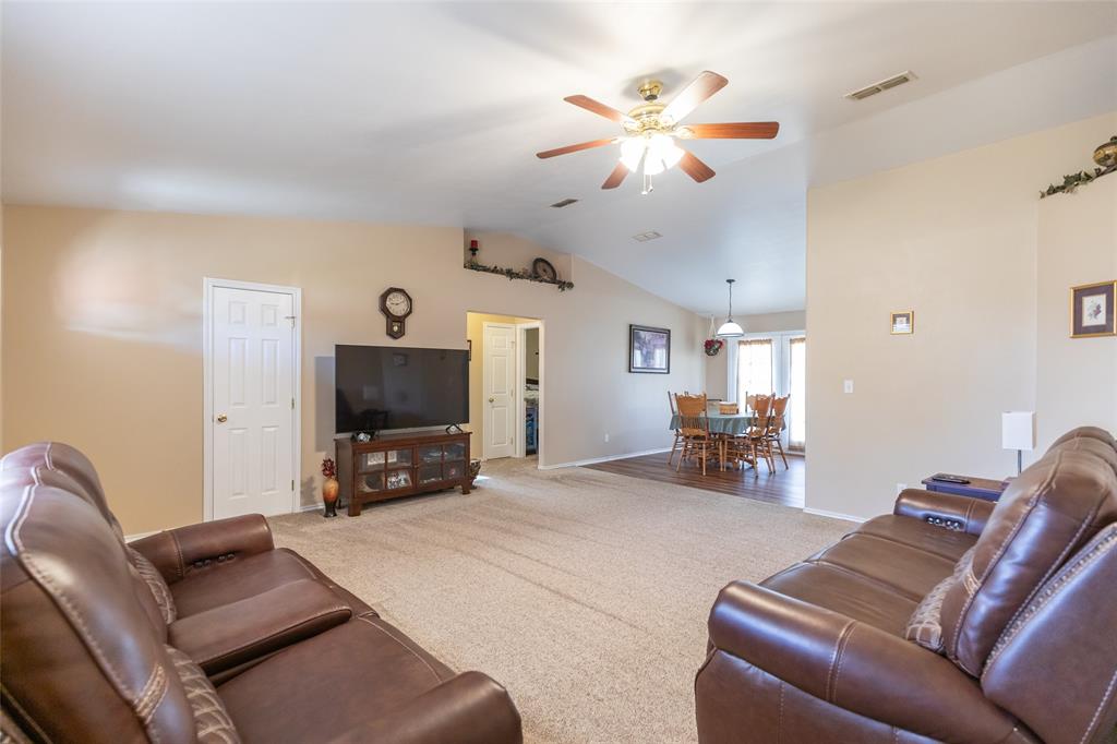 1603 Derrick Drive Haskell, TX 79521 - Photo 3 of 37 a living room with furniture and a flat screen tv