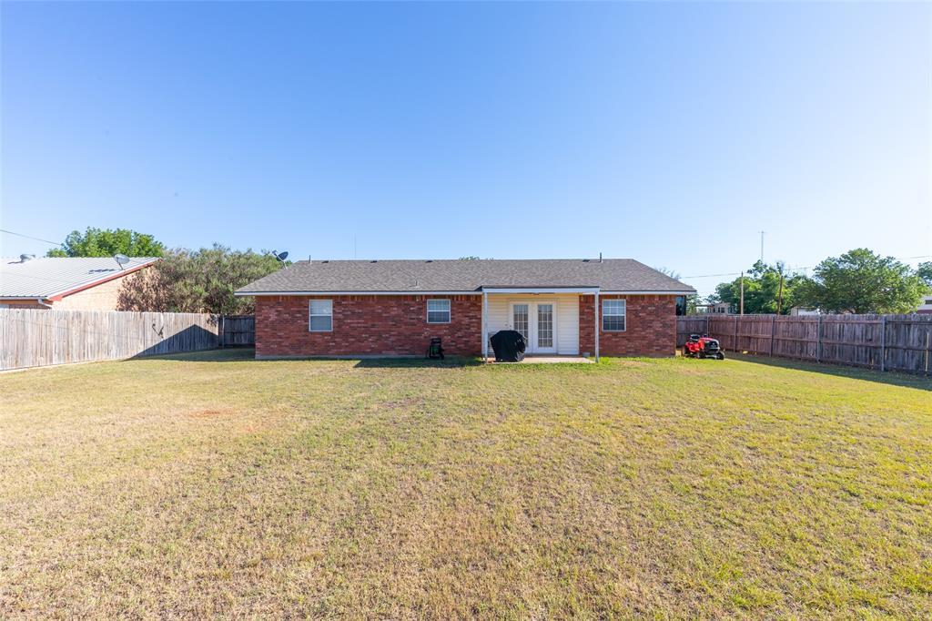 1603 Derrick Drive Haskell, TX 79521 - Photo 32 of 37 a swimming pool with outdoor seating and yard