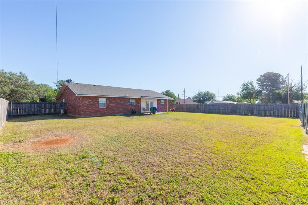 1603 Derrick Drive Haskell, TX 79521 - Photo 33 of 37 a view of a swimming pool with an outdoor space and seating area