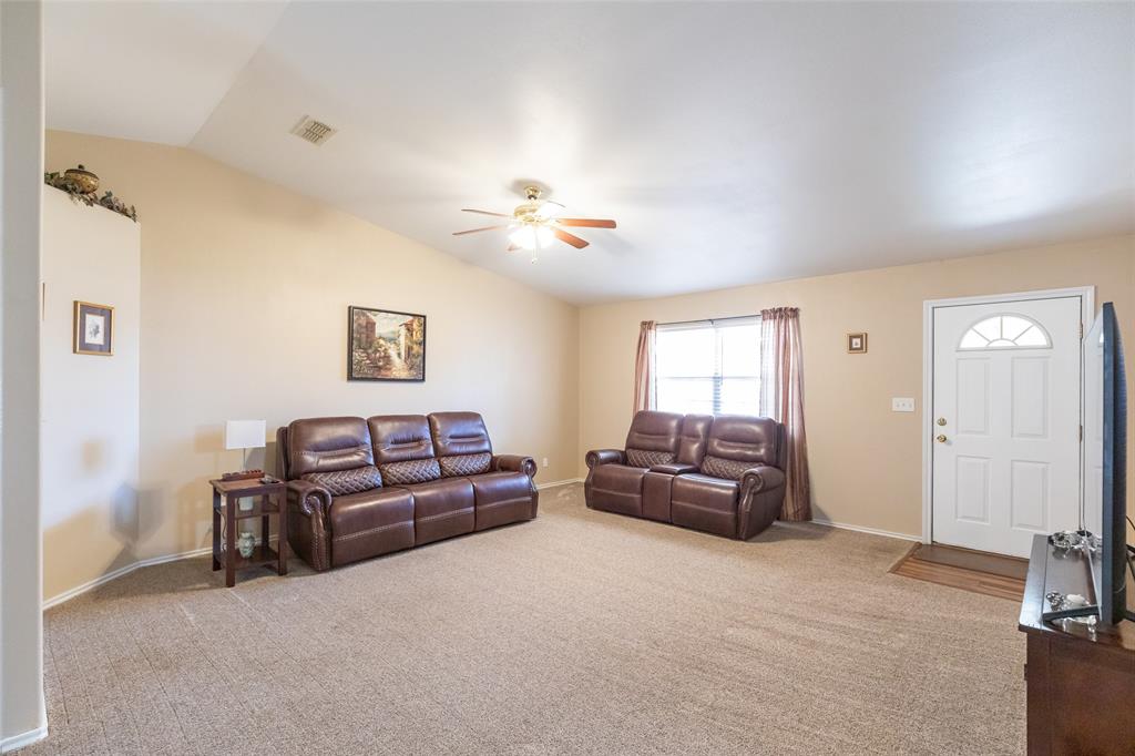 1603 Derrick Drive Haskell, TX 79521 - Photo 4 of 37 a living room with furniture and a ceiling fan