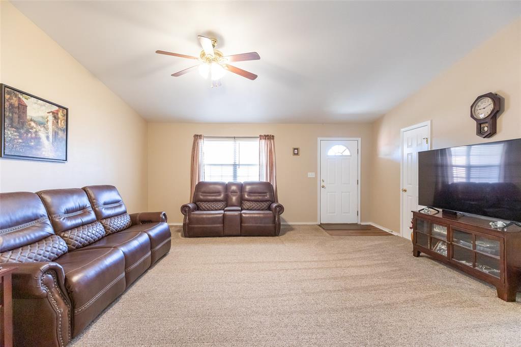 1603 Derrick Drive Haskell, TX 79521 - Photo 5 of 37 a living room with furniture and a flat screen tv