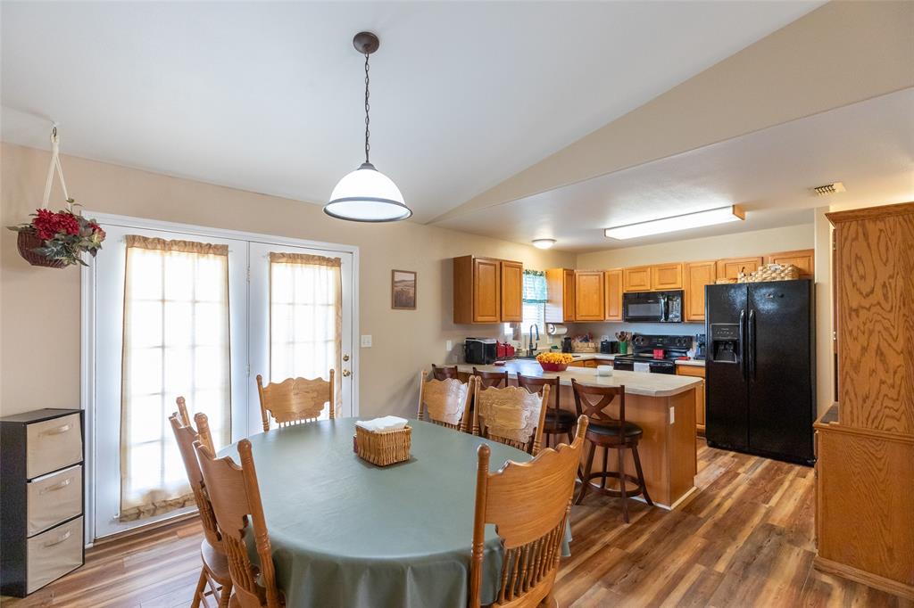 1603 Derrick Drive Haskell, TX 79521 - Photo 6 of 37 a view of a dining room with furniture window and wooden floor