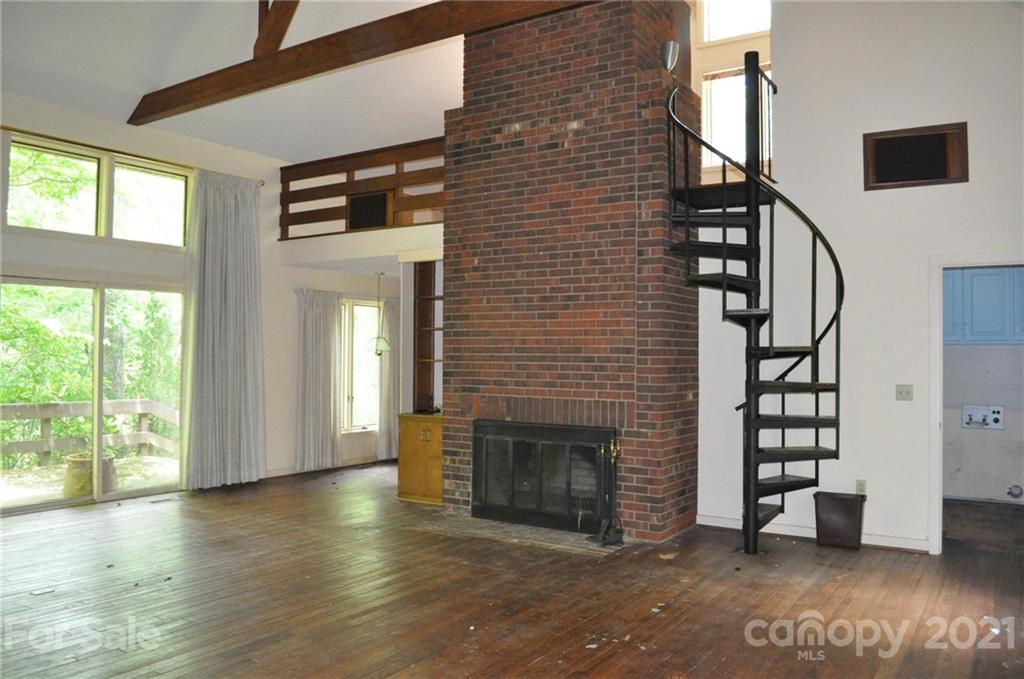 329 Laurel Ridge Road Columbus, NC 28722 - Photo 3 of 6 a view of an entryway with a fireplace