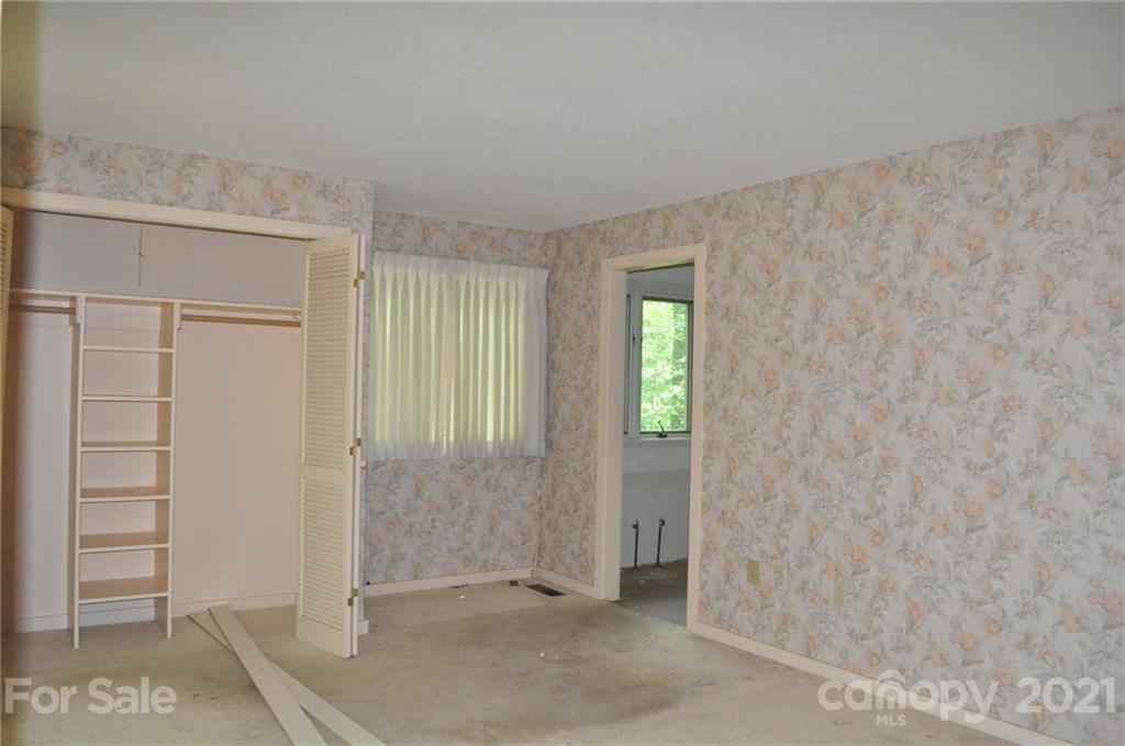 329 Laurel Ridge Road Columbus, NC 28722 - Photo 5 of 6 an empty room with windows