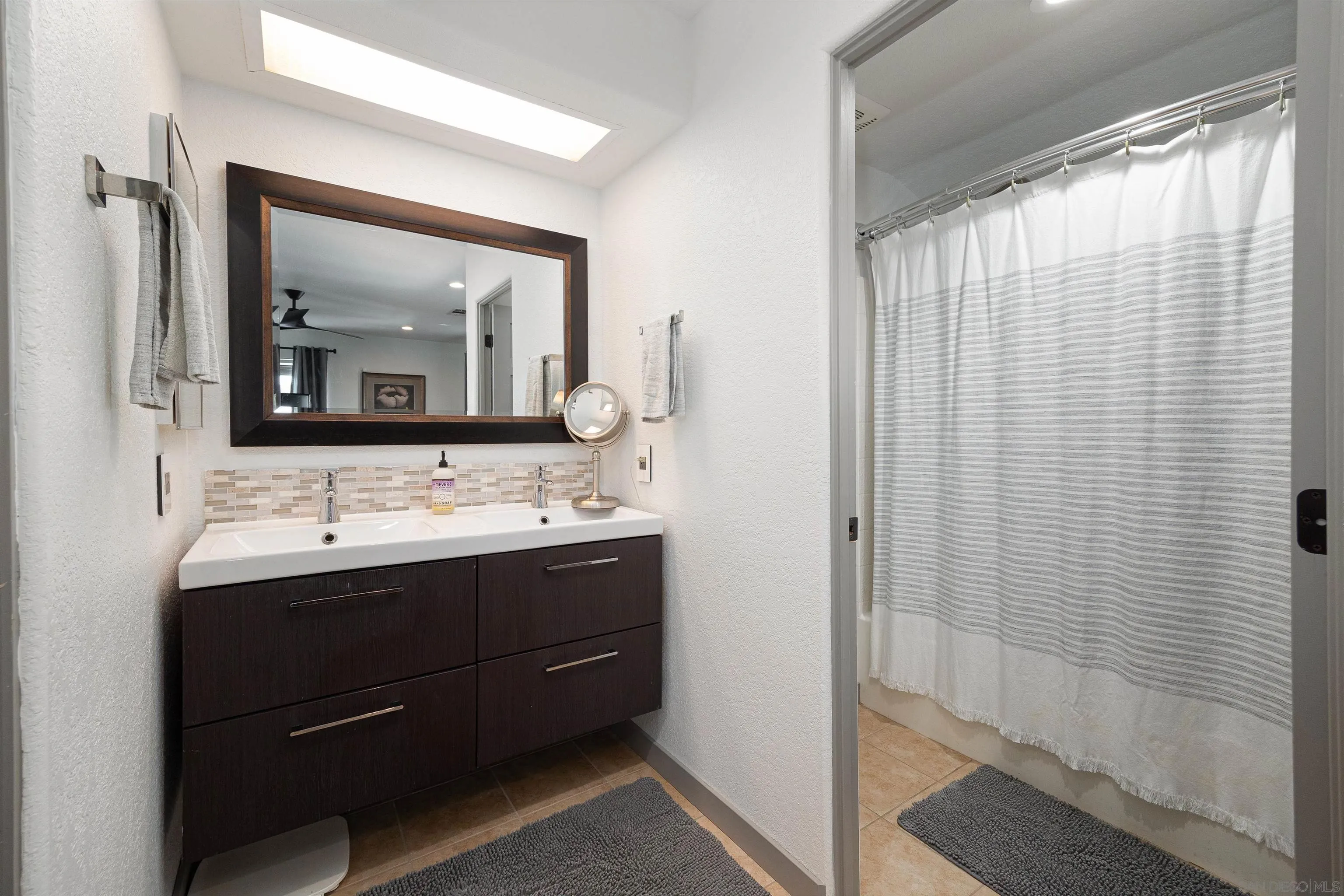 13947 Midland Road Poway, CA 92064 - Photo 12 of 22 a bathroom with a sink and a mirror