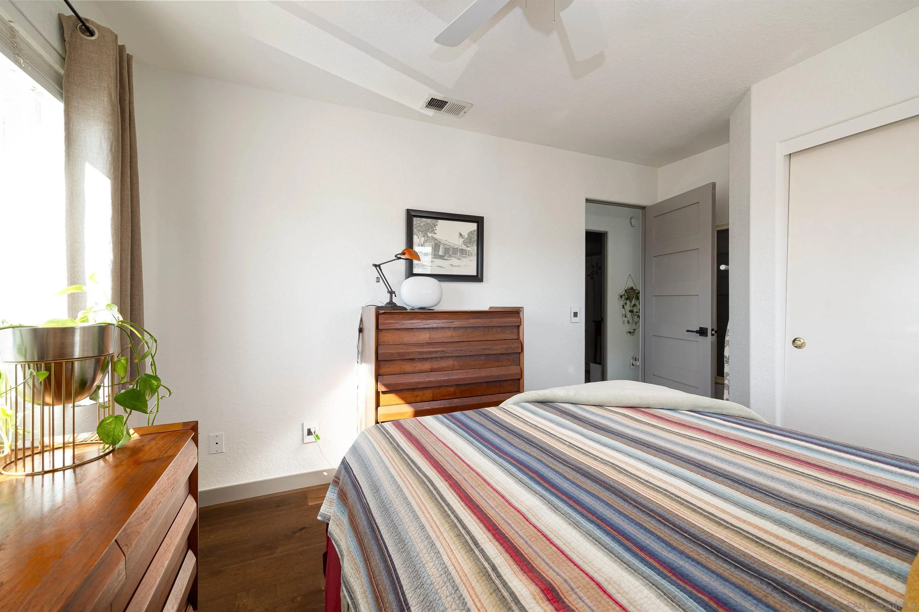 13947 Midland Road Poway, CA 92064 - Photo 14 of 22 a bedroom with a bed and a large window