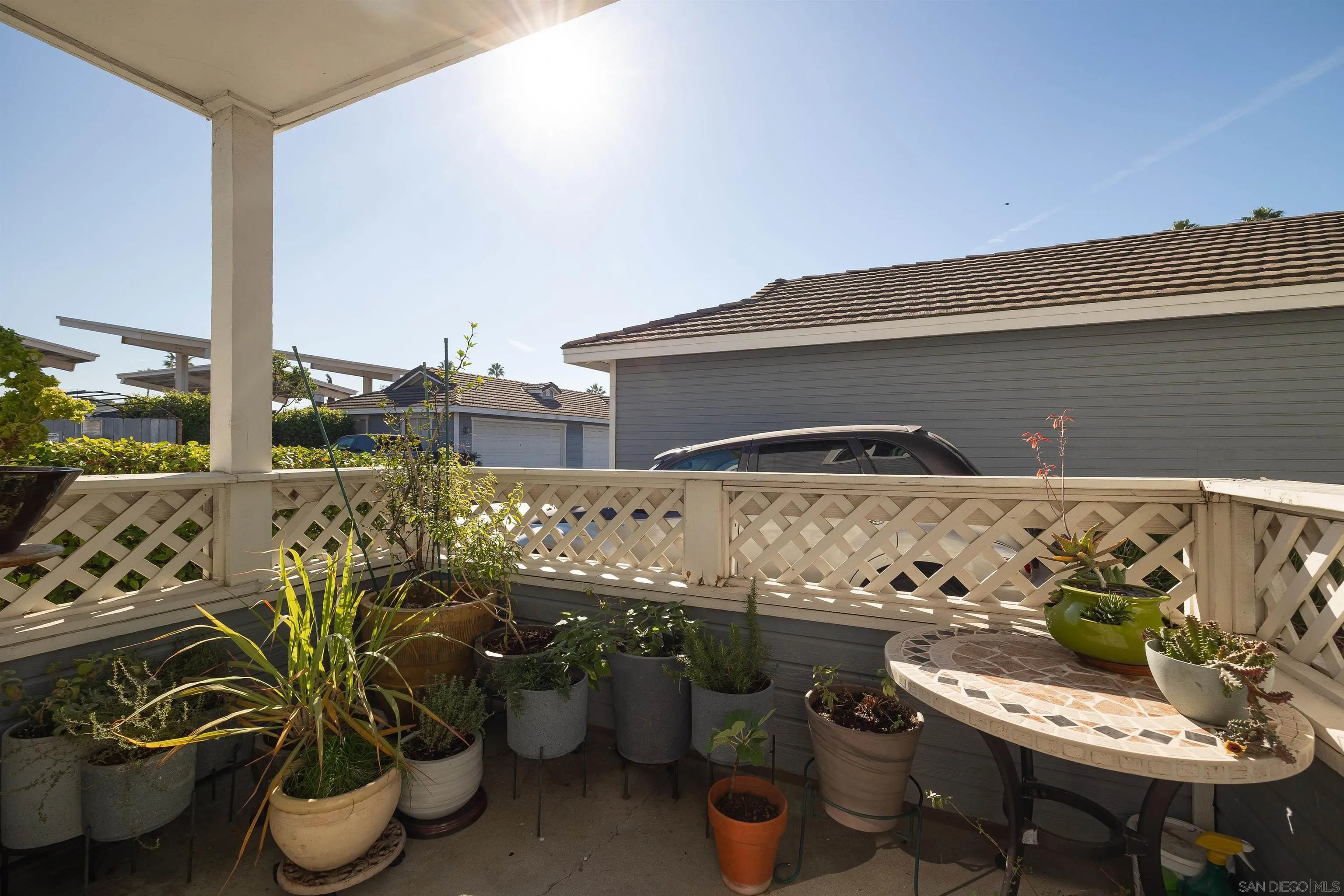 13947 Midland Road Poway, CA 92064 - Photo 18 of 22 a view of a balcony with chairs potted plants