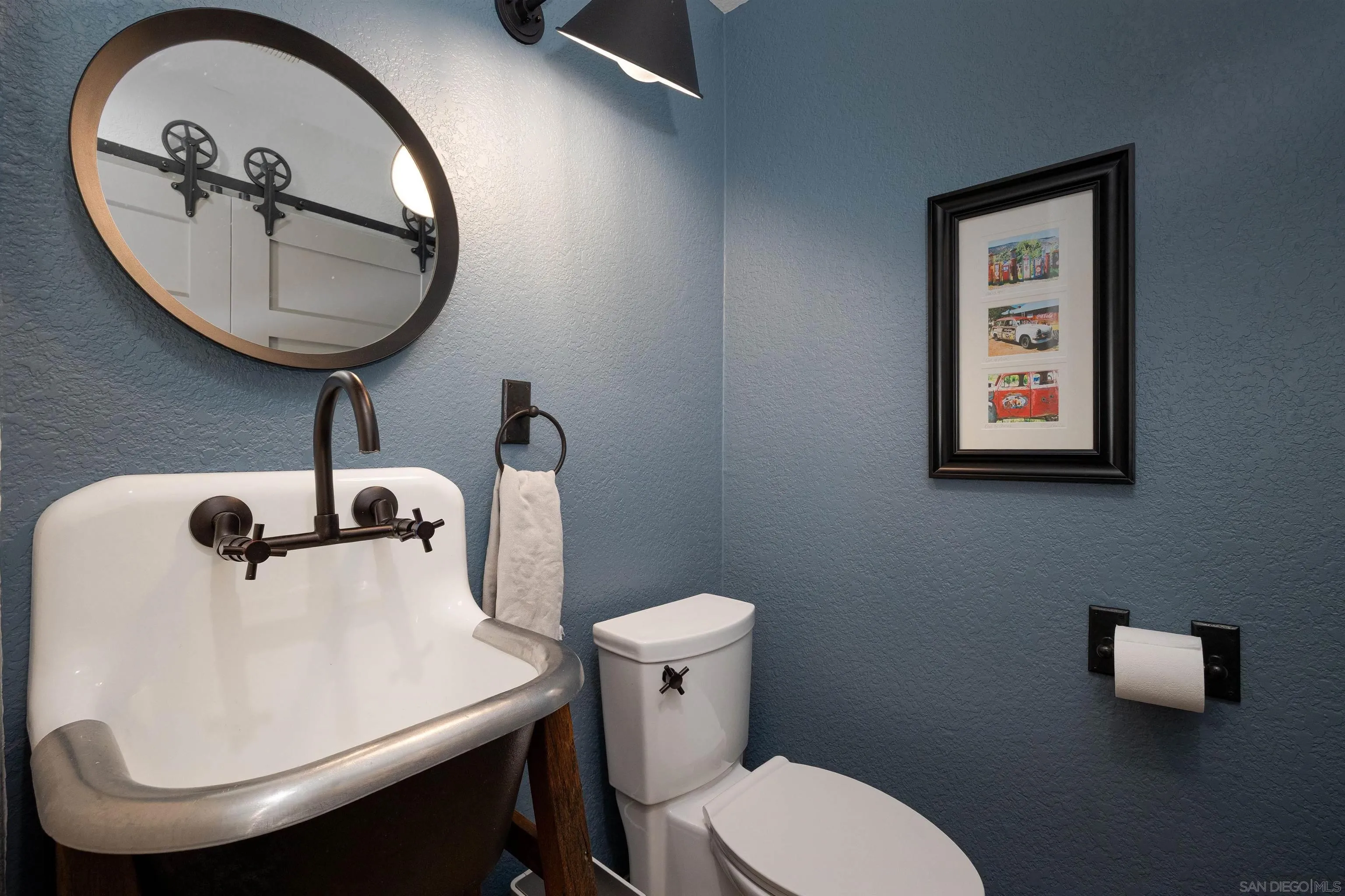 13947 Midland Road Poway, CA 92064 - Photo 8 of 22 a bathroom with a toilet a sink and mirror