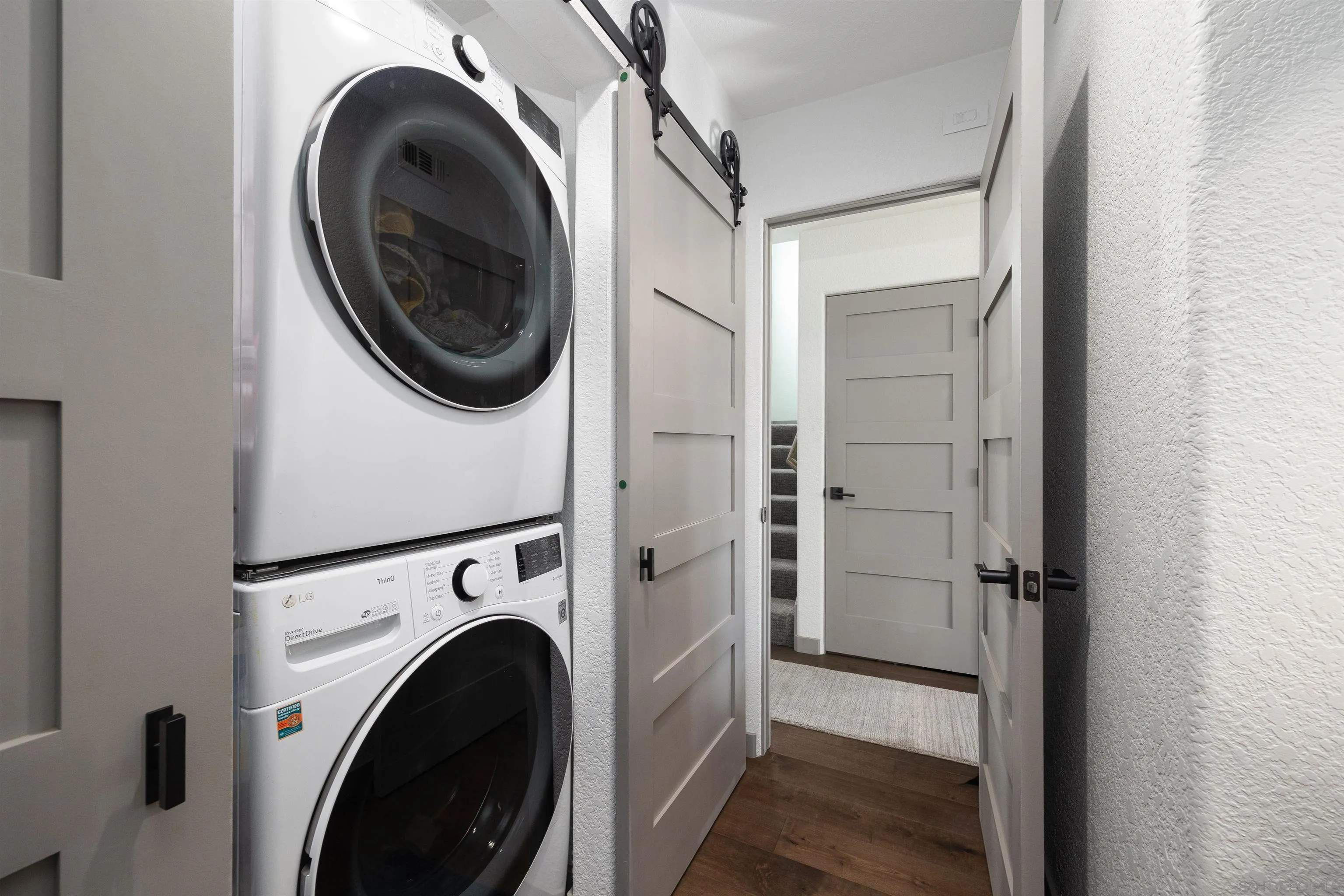13947 Midland Road Poway, CA 92064 - Photo 9 of 22 a view of a hallway with washer and dryer