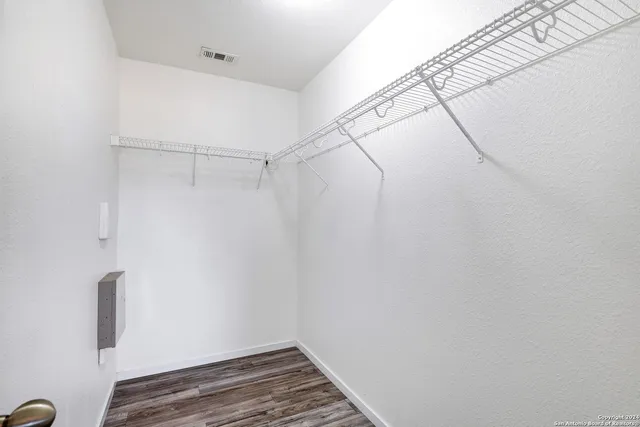 a view of a room with racks on the wall