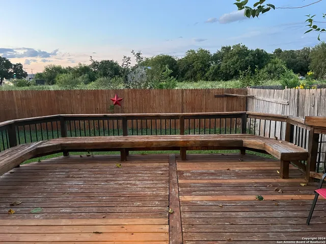 a view of deck with two chairs and a table