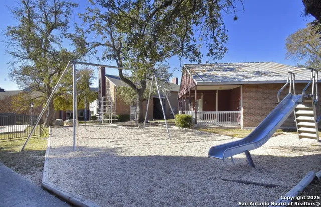 a view of a house with a snow on the tree