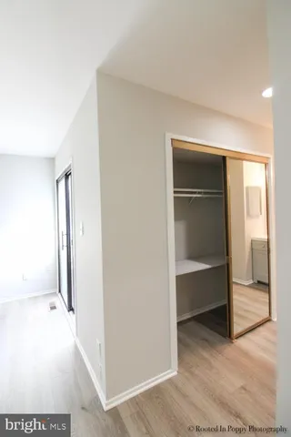 a view of a room with wooden floor and gate