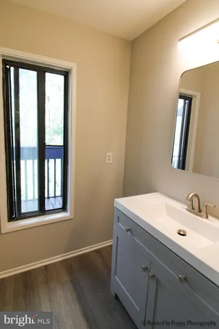 a bathroom with a glass shower door