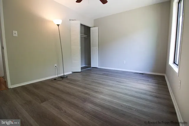 a white toilet sitting next to a small sink