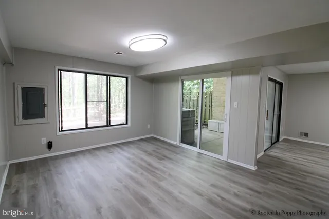 a view of an empty room with stairs and ventilation