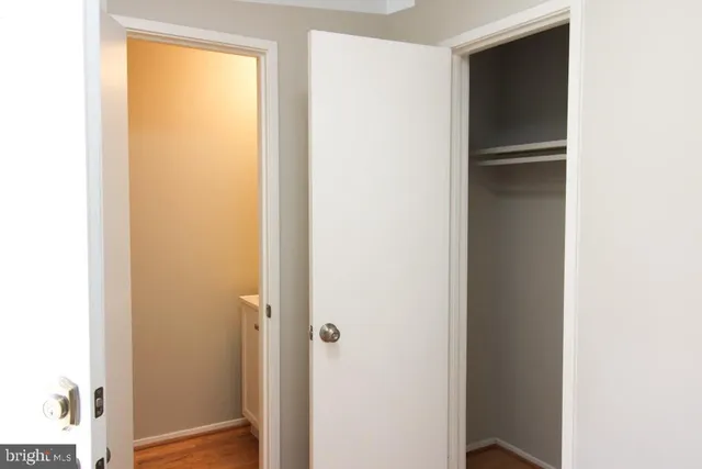 a view of entryway with wooden floor and stairs