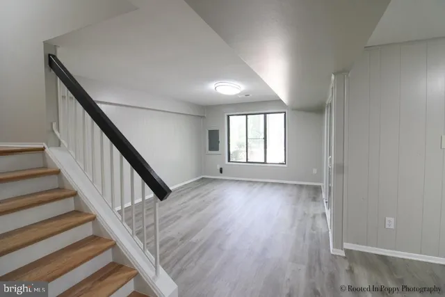 a kitchen with stainless steel appliances a stove a refrigerator and a microwave