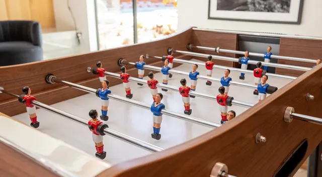 a living room with furniture fireplace and a large window