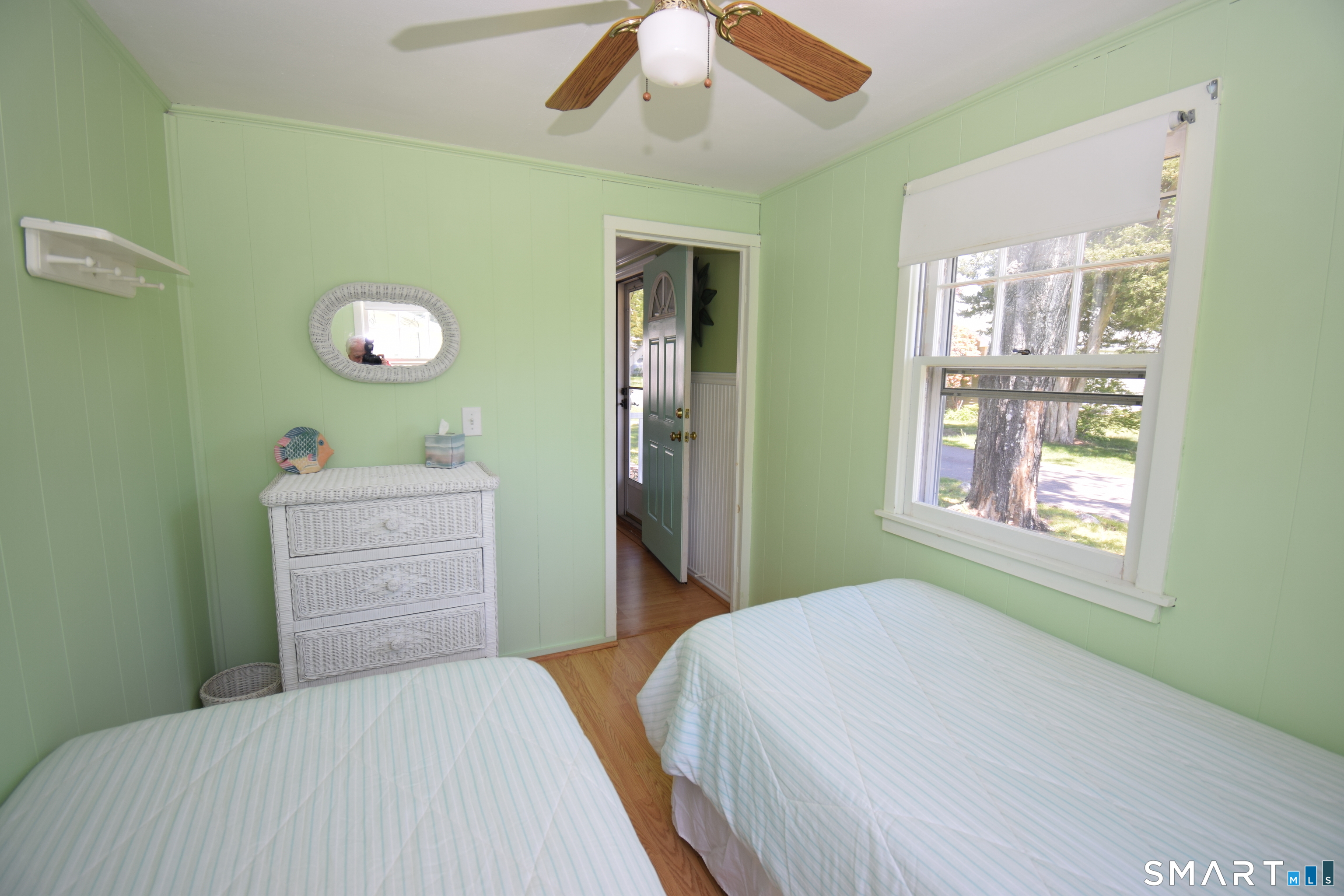 50 East Street Madison, CT 06443 - Photo 13 of 26 a bedroom with a bed and a dresser next to a window