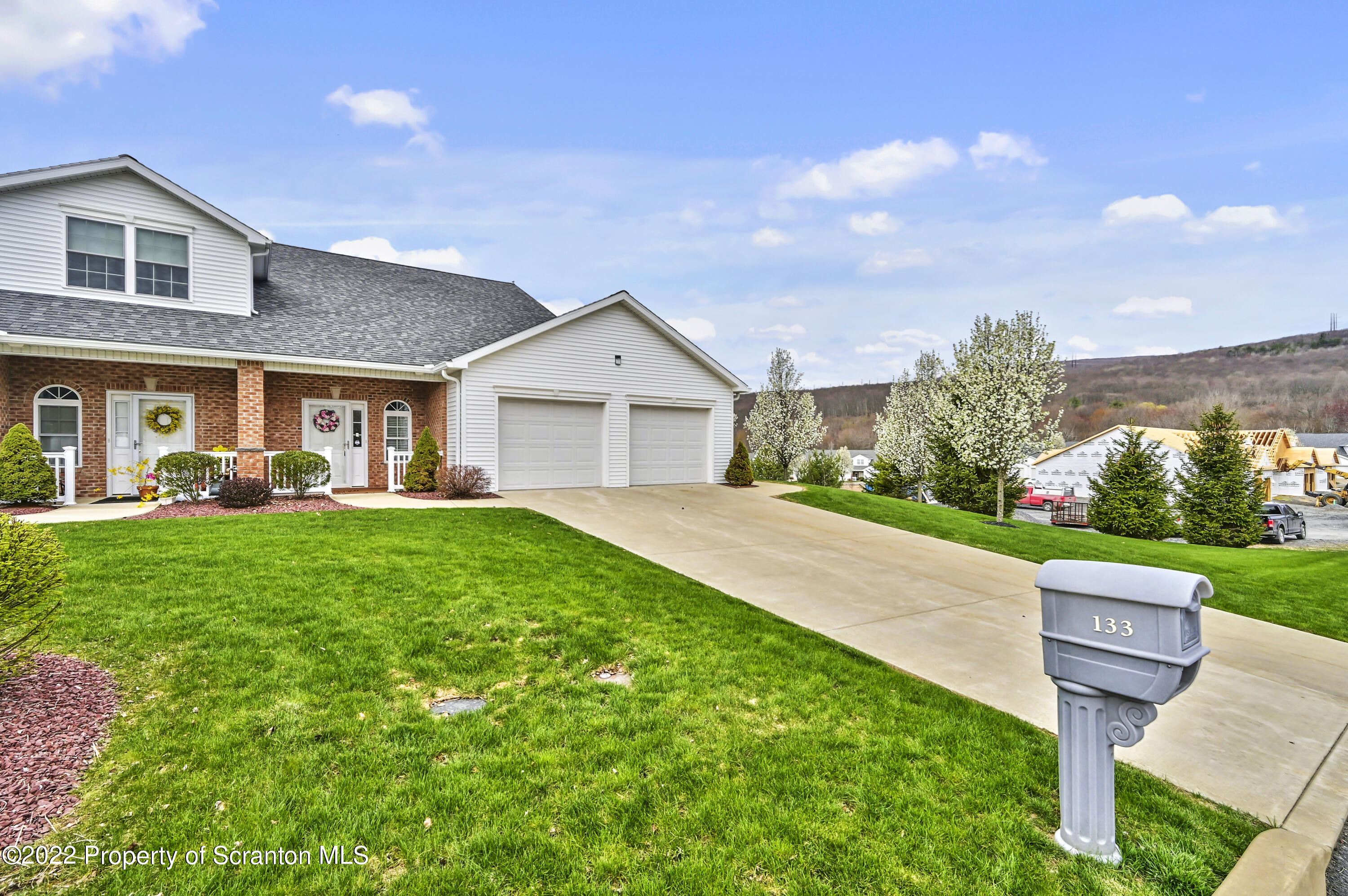133 Pierce Street Eynon, PA 18403 - Photo 2 of 55 a front view of a house with a yard