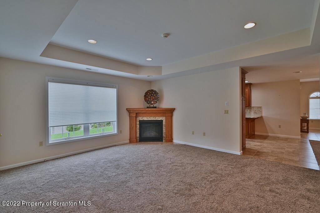 133 Pierce Street Eynon, PA 18403 - Photo 21 of 55 an empty room with windows and fireplace