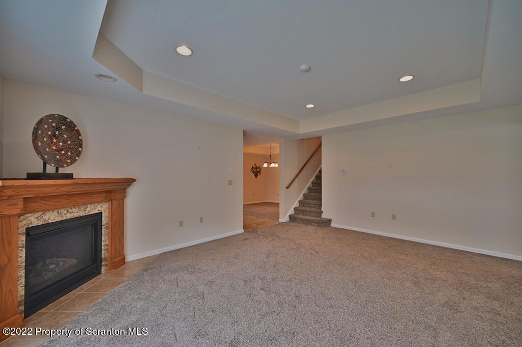 133 Pierce Street Eynon, PA 18403 - Photo 22 of 55 a view of an empty room with a fireplace