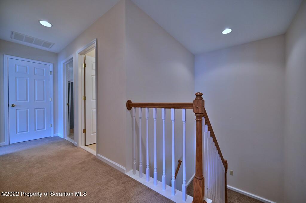 133 Pierce Street Eynon, PA 18403 - Photo 33 of 55 a view of a hallway with wooden floor and staircase