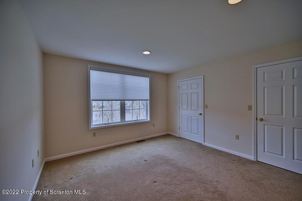 133 Pierce Street Eynon, PA 18403 - Photo 40 of 55 an empty room with a empty space and windows