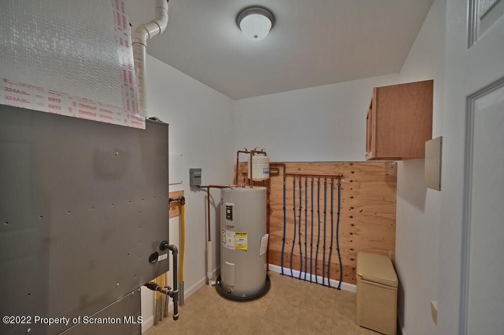 133 Pierce Street Eynon, PA 18403 - Photo 41 of 55 a view of a storage & utility room with a sink