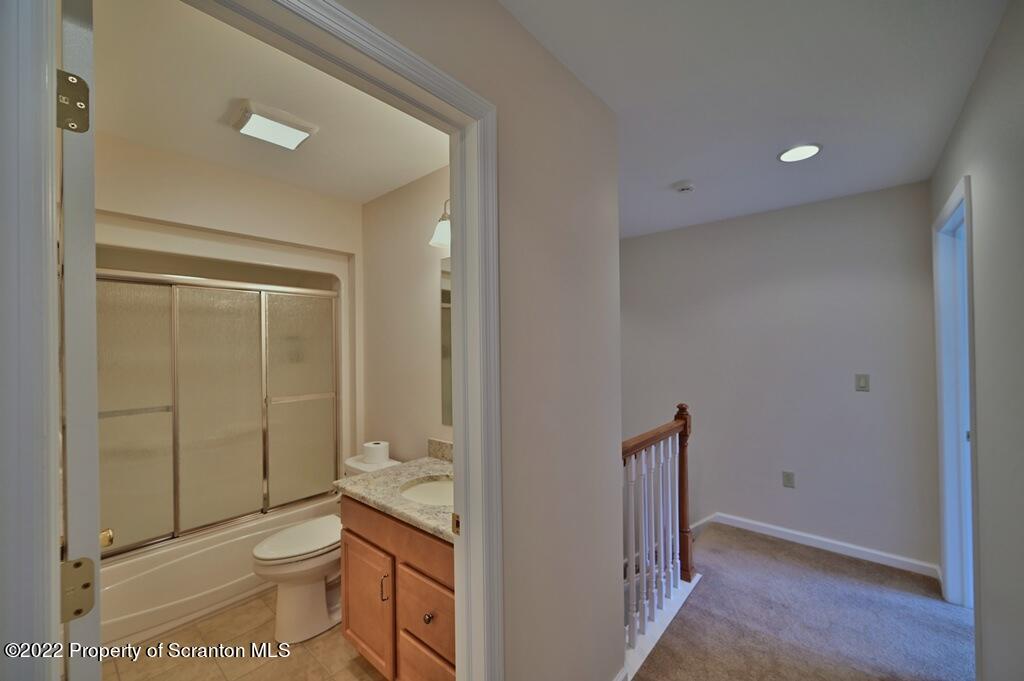 133 Pierce Street Eynon, PA 18403 - Photo 42 of 55 a bathroom with a toilet a sink and shower