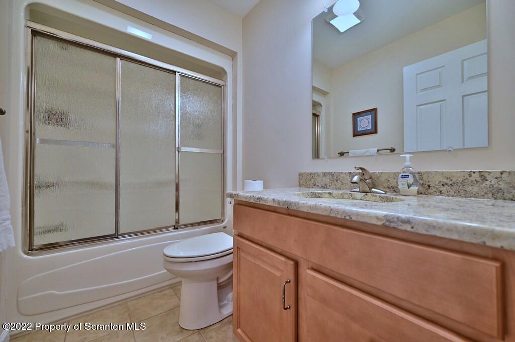 133 Pierce Street Eynon, PA 18403 - Photo 43 of 55 a bathroom with a granite countertop sink toilet and shower