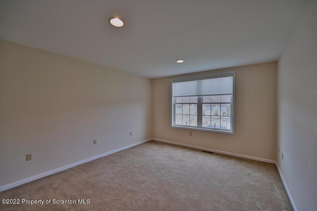 133 Pierce Street Eynon, PA 18403 - Photo 45 of 55 an empty room with a empty space and windows