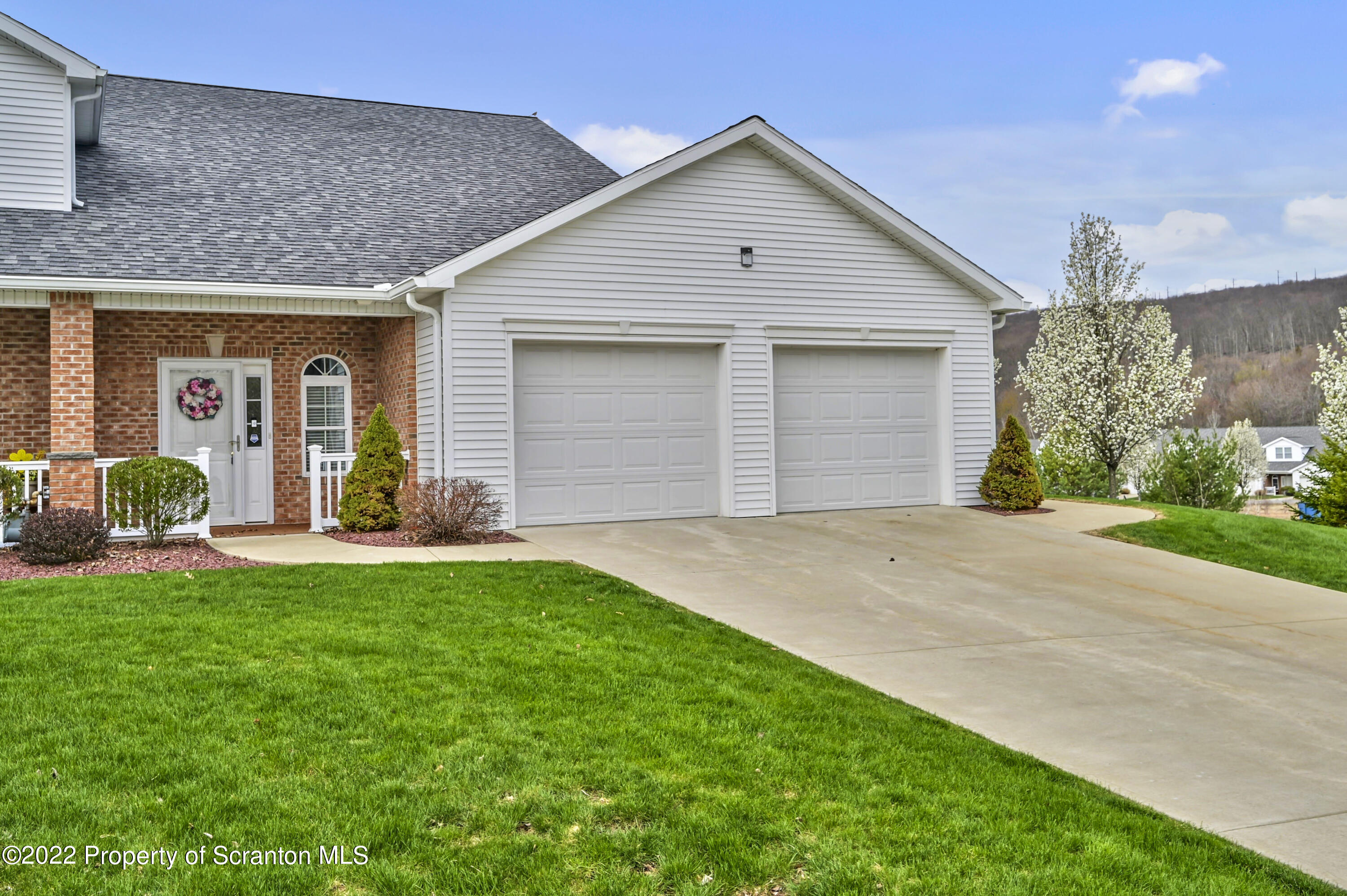 133 Pierce Street Eynon, PA 18403 - Photo 52 of 55 a front view of house with yard and outdoor seating