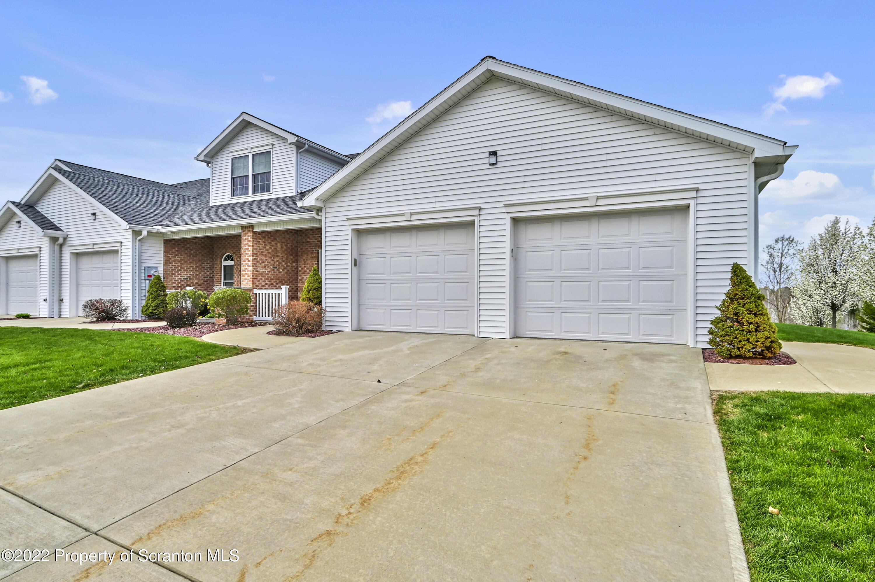 133 Pierce Street Eynon, PA 18403 - Photo 53 of 55 a front view of house with yard and trees around