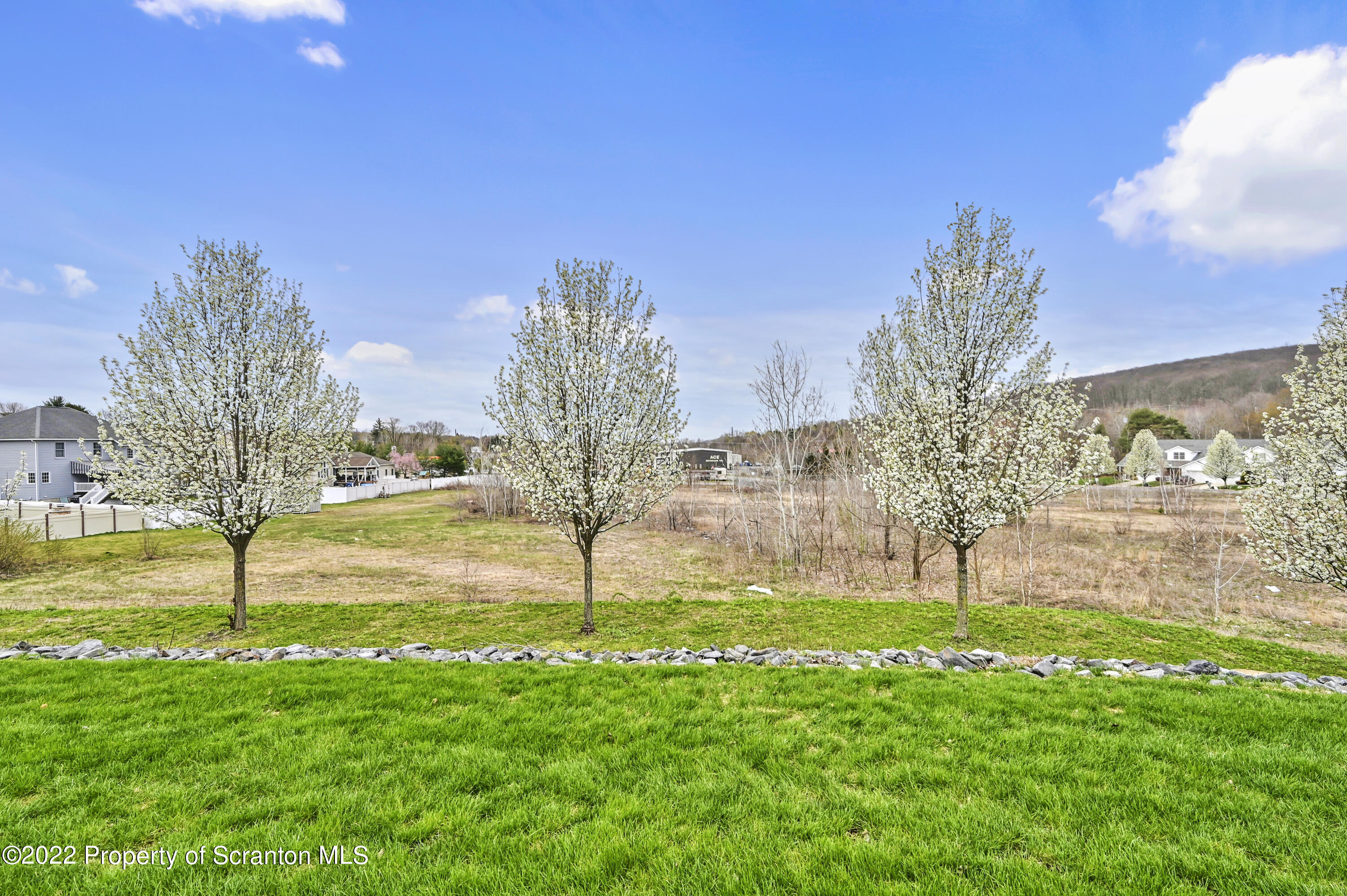 133 Pierce Street Eynon, PA 18403 - Photo 54 of 55 a view of a garden with a building