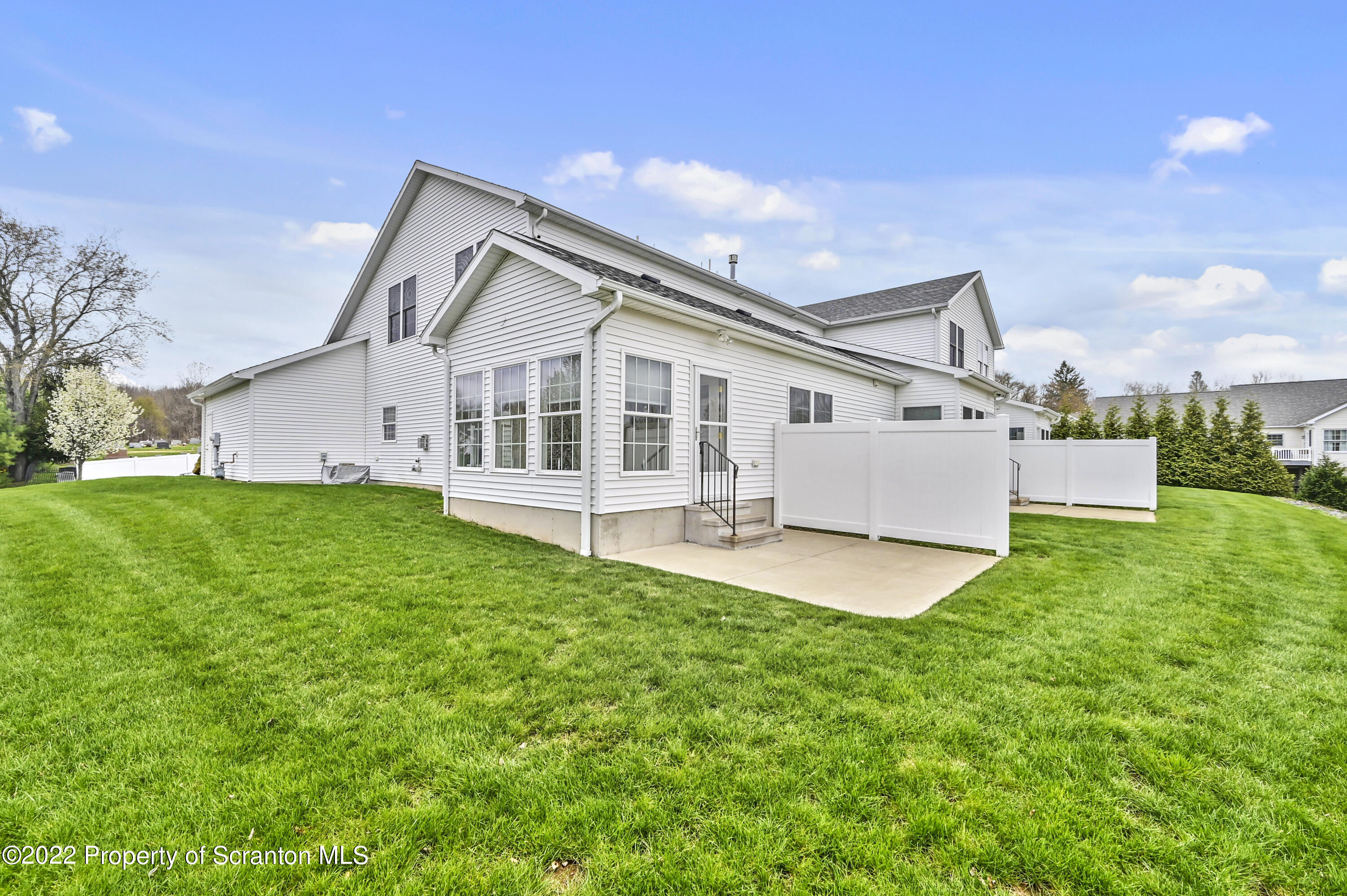 133 Pierce Street Eynon, PA 18403 - Photo 55 of 55 a view of a house with a big yard and large trees