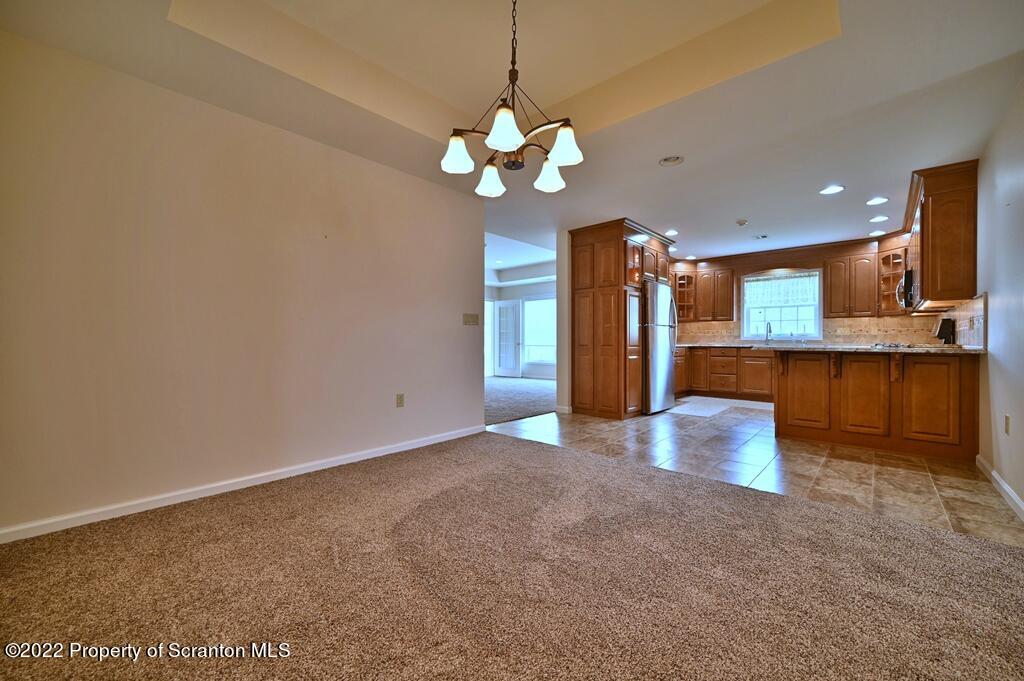 133 Pierce Street Eynon, PA 18403 - Photo 10 of 55 a view of an empty room with a kitchen