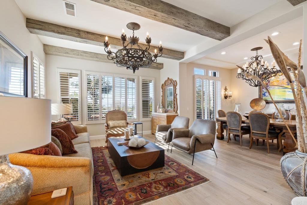 2721 MacKinnon Ranch Road Cardiff-by-the-Sea, CA 92007 - Photo 11 of 38 a living room with furniture chandelier and a chandelier