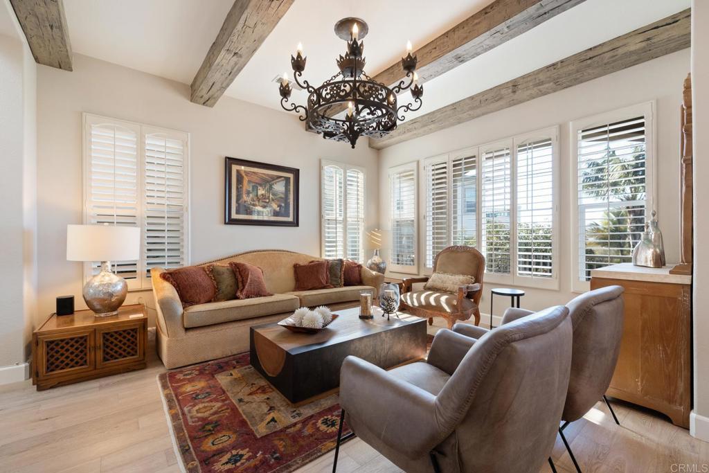 2721 MacKinnon Ranch Road Cardiff-by-the-Sea, CA 92007 - Photo 12 of 38 a living room with furniture and a large window
