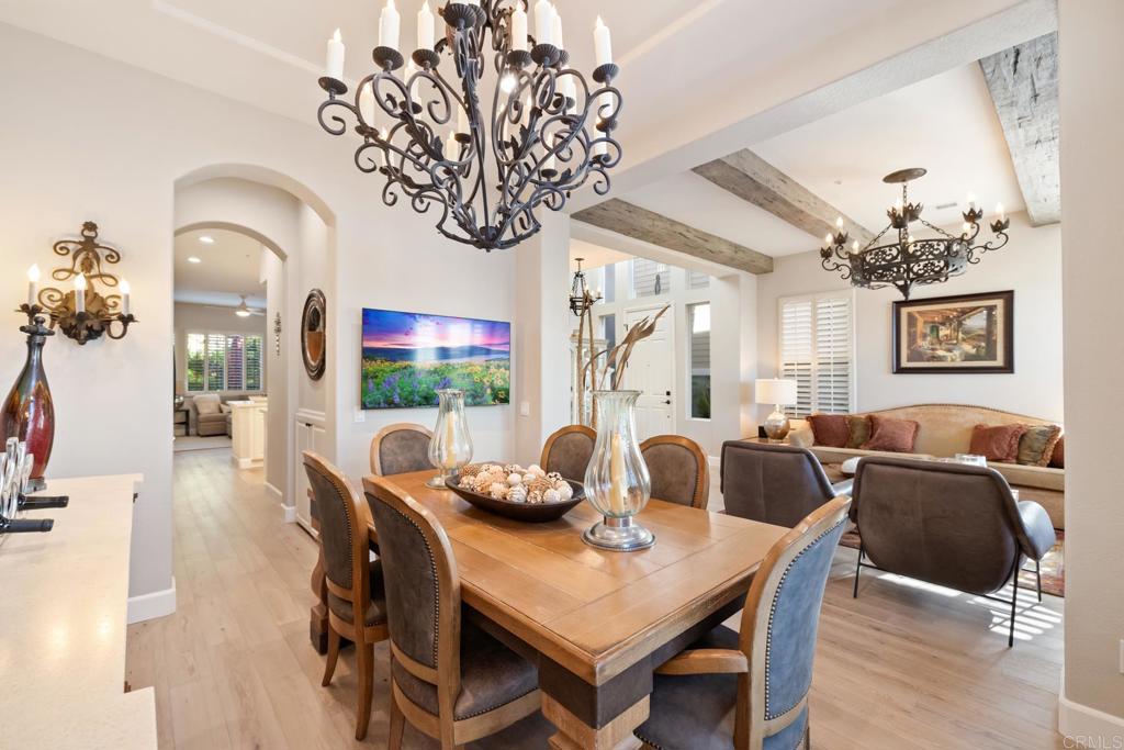 2721 MacKinnon Ranch Road Cardiff-by-the-Sea, CA 92007 - Photo 13 of 38 a view of a dining room with furniture wooden floor and chandelier