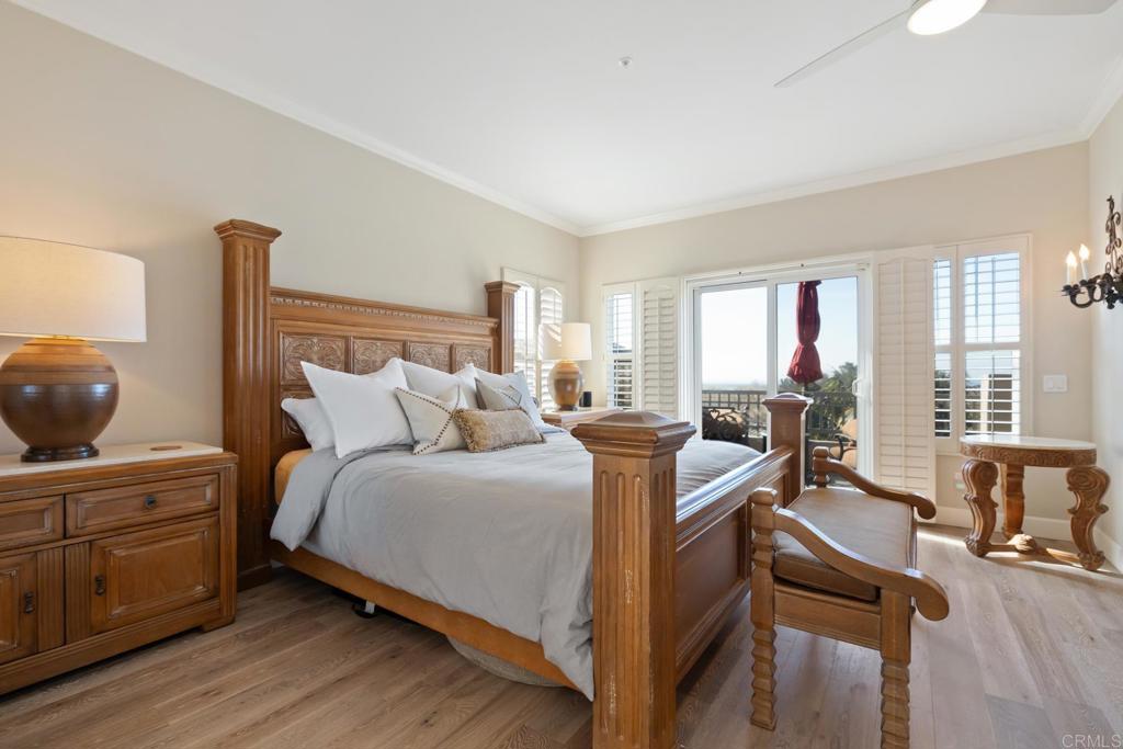 2721 MacKinnon Ranch Road Cardiff-by-the-Sea, CA 92007 - Photo 14 of 38 a bedroom with a bed and wooden floor