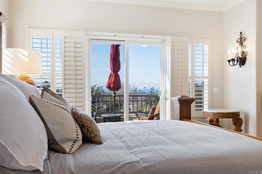 2721 MacKinnon Ranch Road Cardiff-by-the-Sea, CA 92007 - Photo 15 of 38 a bed room with a bed and a large window