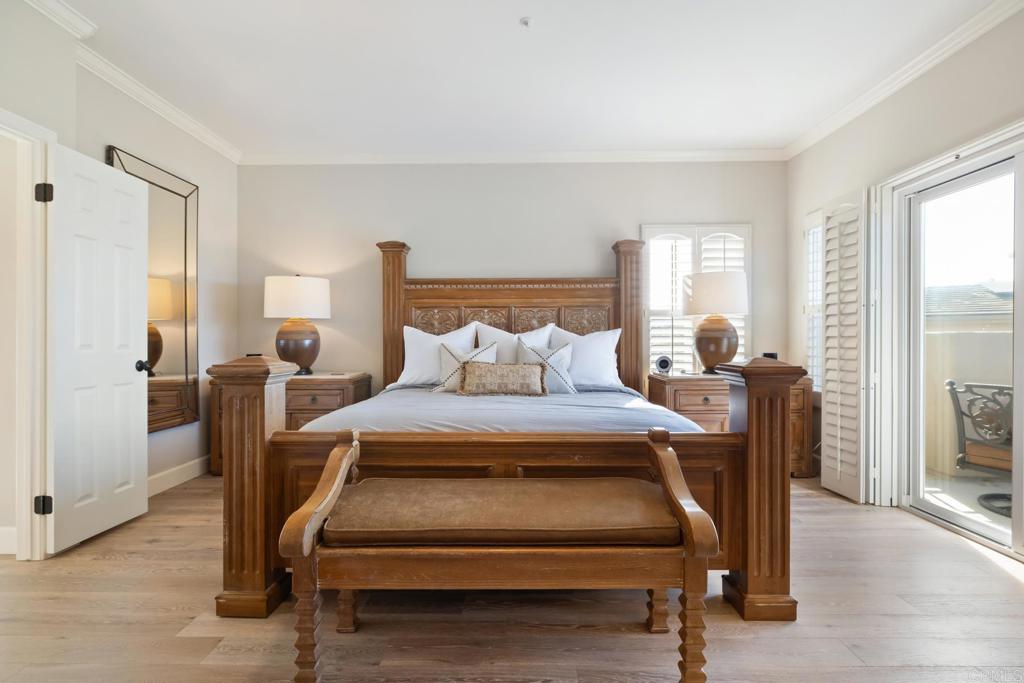 2721 MacKinnon Ranch Road Cardiff-by-the-Sea, CA 92007 - Photo 16 of 38 a bedroom with furniture and a window