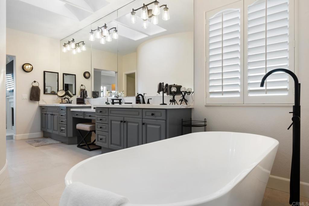 2721 MacKinnon Ranch Road Cardiff-by-the-Sea, CA 92007 - Photo 19 of 38 a kitchen with a sink a counter space appliances and cabinets