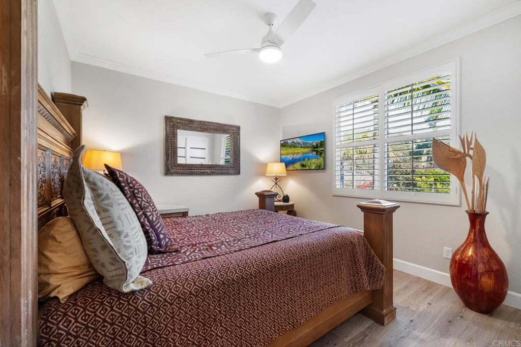 2721 MacKinnon Ranch Road Cardiff-by-the-Sea, CA 92007 - Photo 26 of 38 a bedroom with a large bed and a window