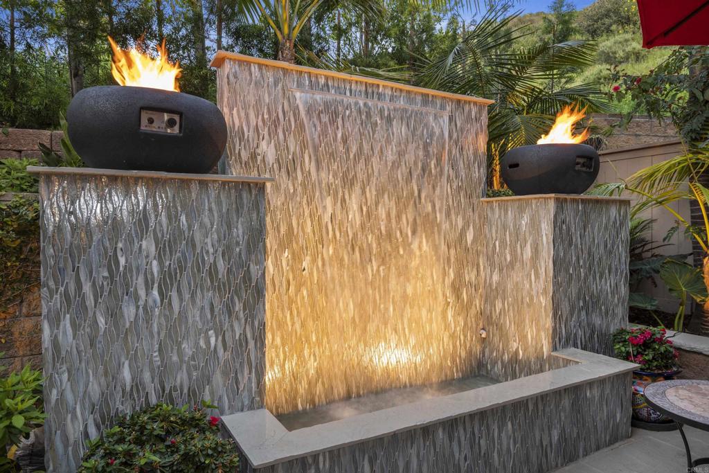 2721 MacKinnon Ranch Road Cardiff-by-the-Sea, CA 92007 - Photo 33 of 38 a view of a wooden fence and a tree in front of it