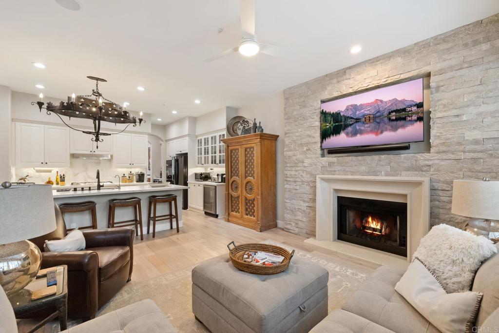 2721 MacKinnon Ranch Road Cardiff-by-the-Sea, CA 92007 - Photo 8 of 38 a living room with furniture and a fireplace