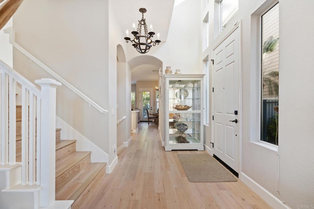 2721 MacKinnon Ranch Road Cardiff-by-the-Sea, CA 92007 - Photo 10 of 38 a view of a hallway with wooden floor and staircase