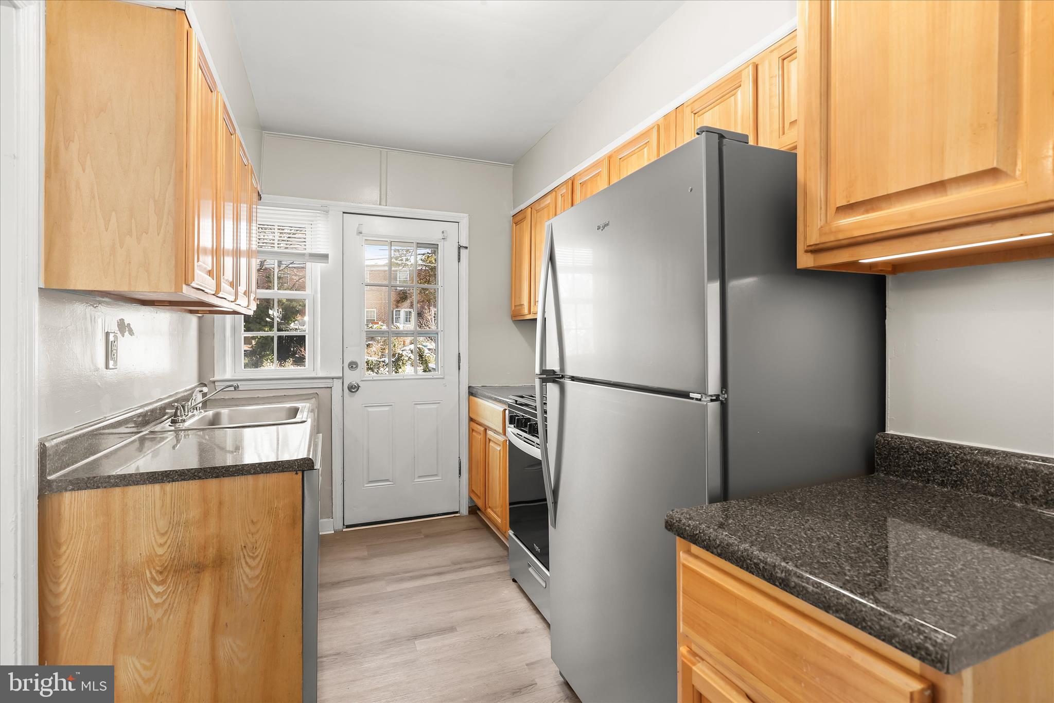 1945 Edgewood Road Towson, MD 21286 - Photo 14 of 46 a kitchen with stainless steel appliances granite countertop a refrigerator and a sink
